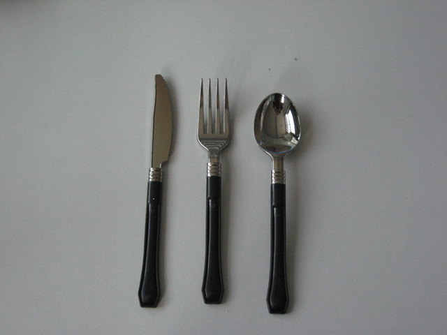 Silver cutlery with black handel